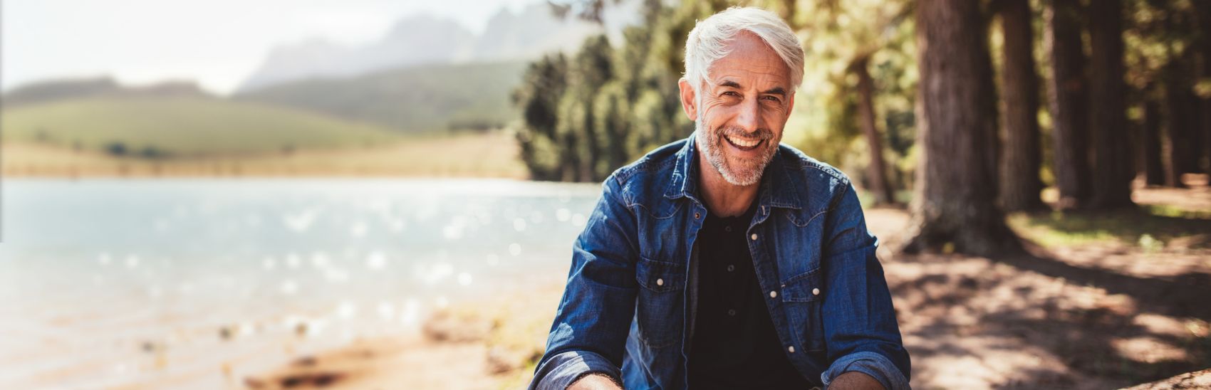 A man outdoors experiencing life free from pain.