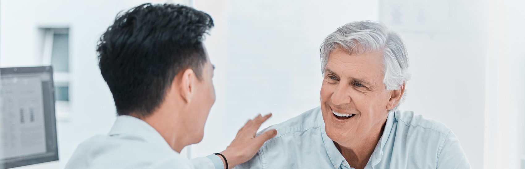 A pain management doctor explaining pain treatment to his chronic pain patient.