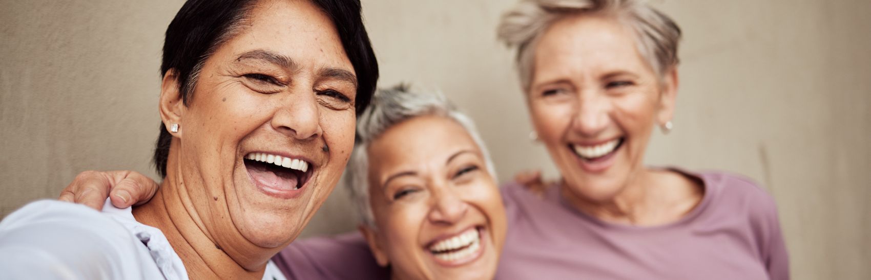 Three best friends smiling from pain relief.