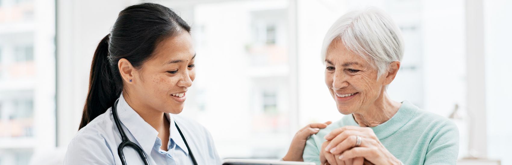 A pain management doctor and patient discussing the next course of action in her pain management.